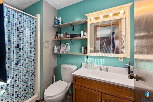 bathroom featuring toilet, a shower with curtain, and vanity