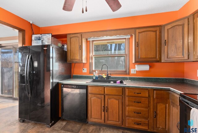 kitchen featuring a ceiling fan, brown cabinets, a sink, and black appliances