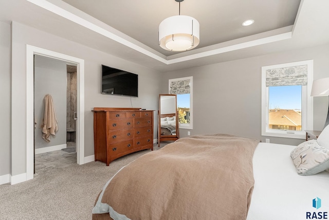 bedroom with carpet floors, recessed lighting, a raised ceiling, and baseboards