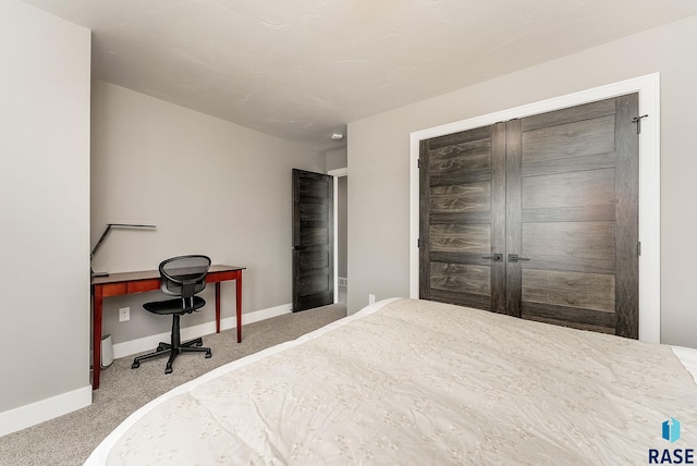 bedroom with carpet and baseboards