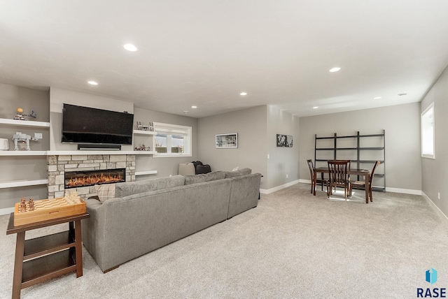 living room with a fireplace, baseboards, carpet flooring, and recessed lighting