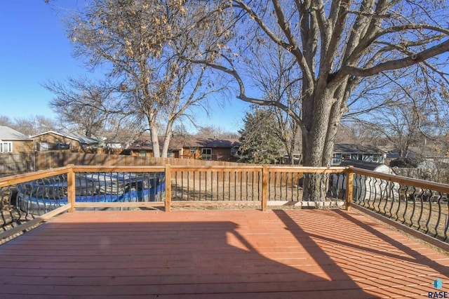 deck featuring a fenced backyard and a residential view