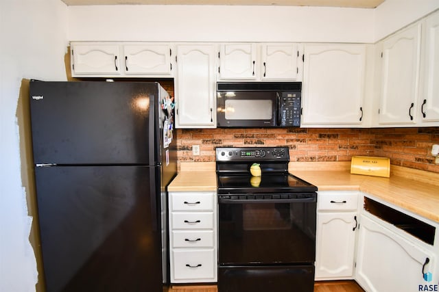 kitchen featuring white cabinets and black appliances