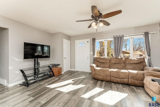 living room with wood finished floors and baseboards