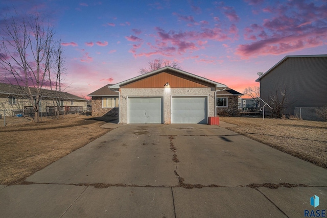 view of front of property with a garage and concrete driveway