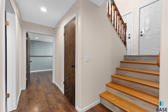 stairs with recessed lighting, wood finished floors, and baseboards