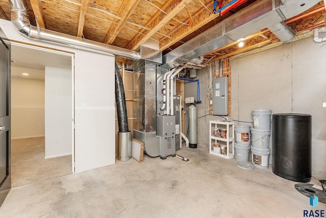 unfinished basement featuring electric panel and heating unit