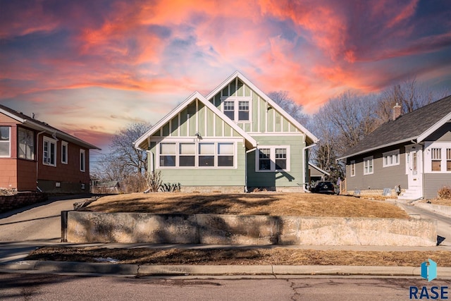 view of front of property with entry steps and board and batten siding