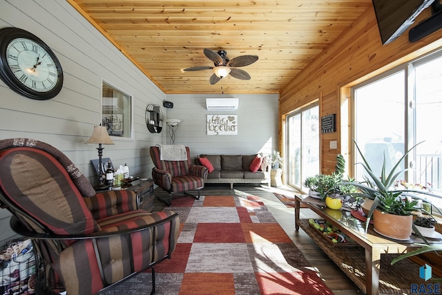 sunroom / solarium with wooden ceiling, a ceiling fan, and a wall mounted AC