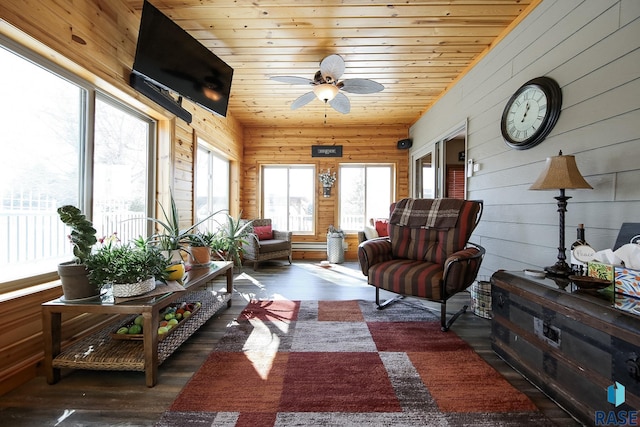 sunroom / solarium with ceiling fan, wooden ceiling, and lofted ceiling