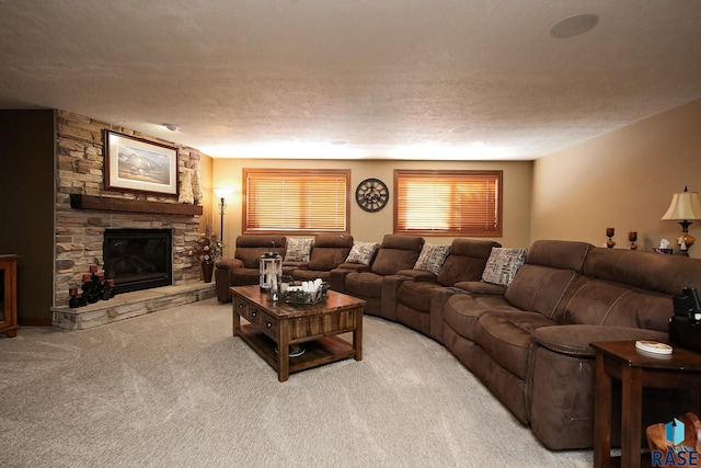 living area with carpet, a fireplace, and a textured ceiling