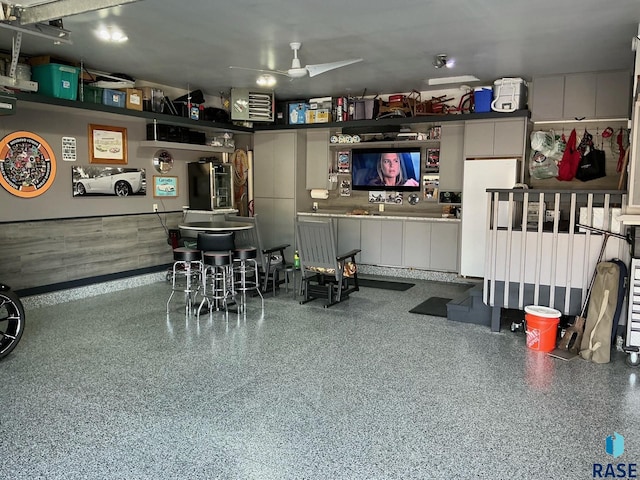 garage featuring ceiling fan and freestanding refrigerator