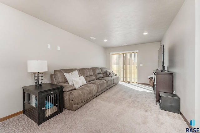 living room with carpet floors, visible vents, baseboards, and recessed lighting