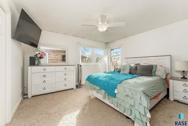 bedroom with ceiling fan and baseboards