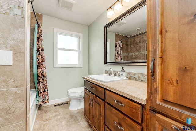 bathroom with toilet, tile patterned flooring, vanity, and visible vents