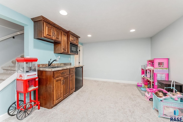 kitchen with dishwasher, light colored carpet, black microwave, a sink, and recessed lighting