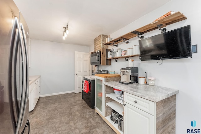 kitchen with freestanding refrigerator, black microwave, white range with electric stovetop, and open shelves