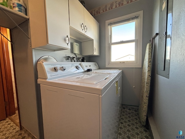 laundry area with washing machine and dryer, cabinet space, and tile patterned floors