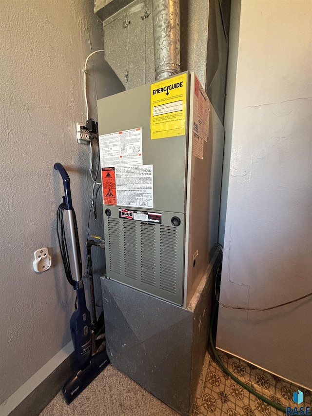 utility room with heating unit