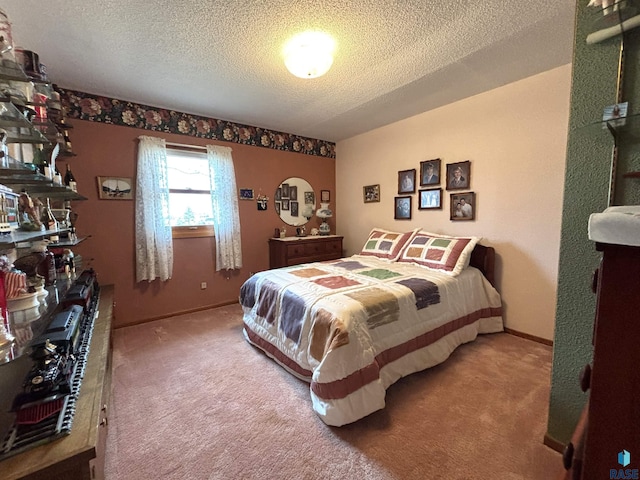 bedroom with carpet, a textured ceiling, and baseboards