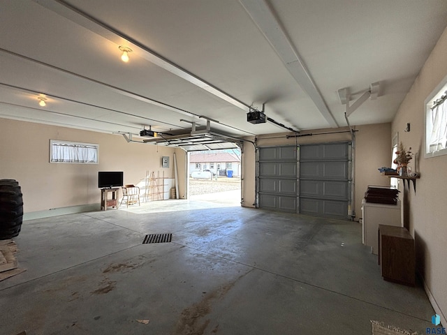 garage featuring a garage door opener