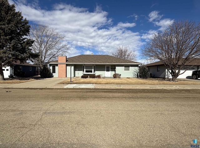 single story home with a chimney