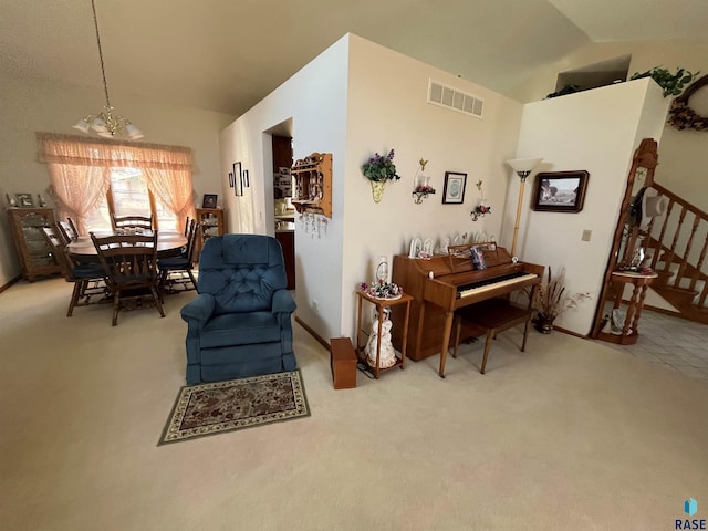 living area featuring stairway, visible vents, vaulted ceiling, and carpet flooring