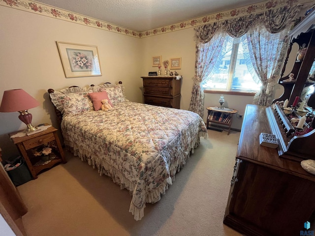 carpeted bedroom featuring a textured ceiling