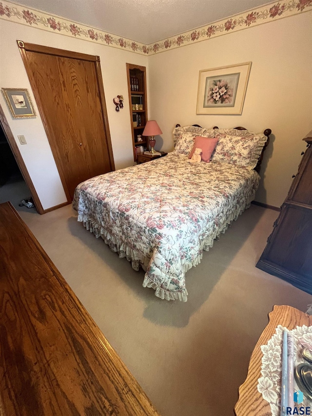 bedroom featuring a closet and carpet