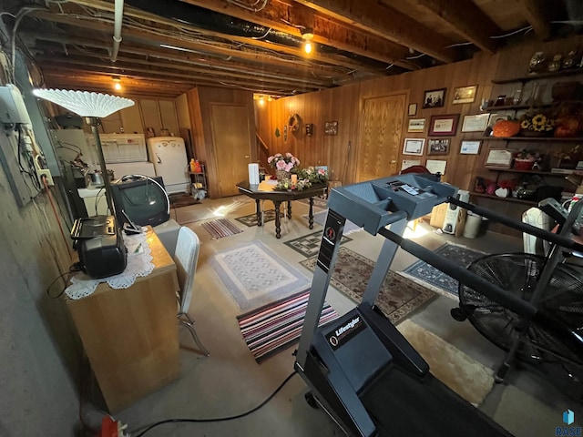 workout room featuring wooden walls