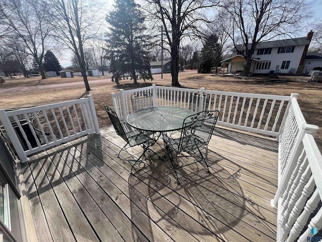 wooden deck with outdoor dining area