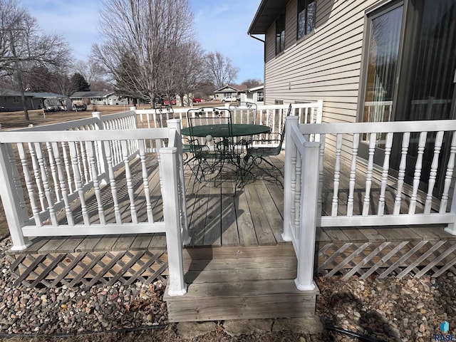 wooden deck featuring outdoor dining space