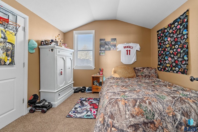 carpeted bedroom with vaulted ceiling