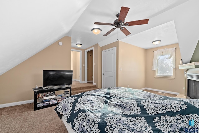 bedroom with a ceiling fan, lofted ceiling, carpet flooring, and baseboards