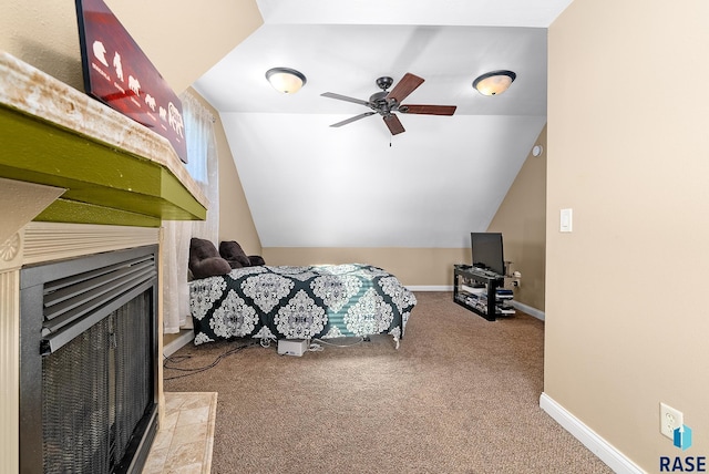 carpeted bedroom with vaulted ceiling and baseboards