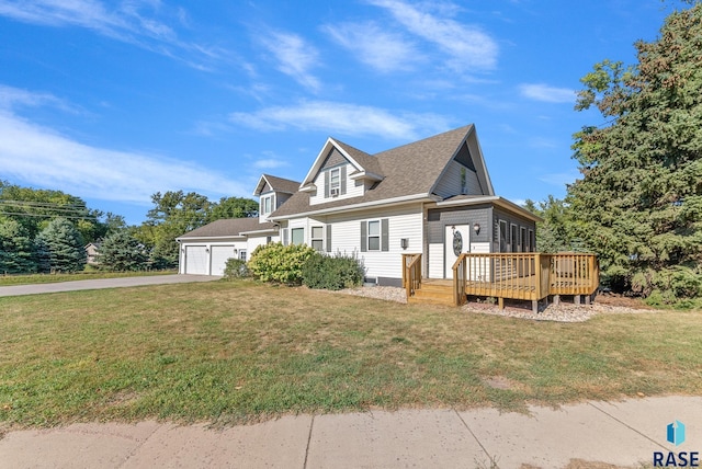 view of front of property featuring aphalt driveway, an attached garage, a deck, and a front lawn