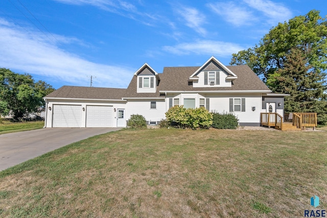 cape cod house featuring a front lawn, concrete driveway, a shingled roof, and an attached garage