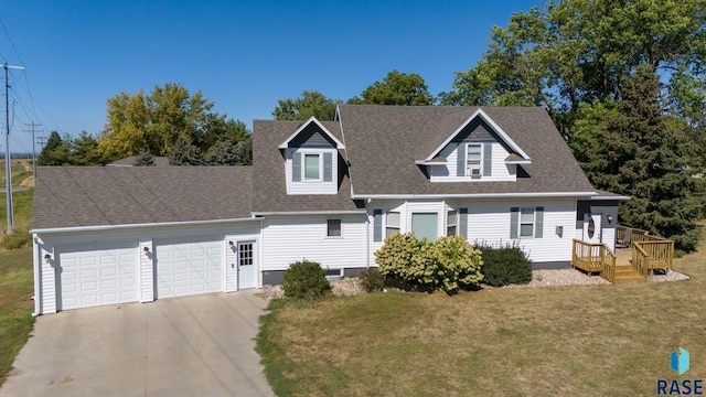 view of front of property with a garage, a front yard, concrete driveway, and roof with shingles