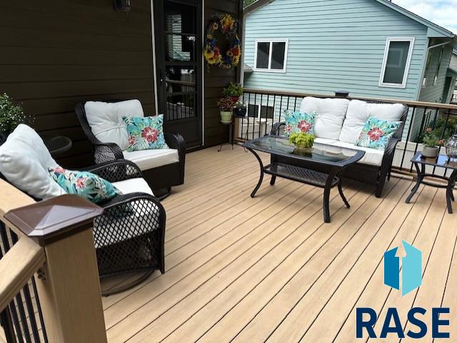 wooden terrace featuring an outdoor hangout area