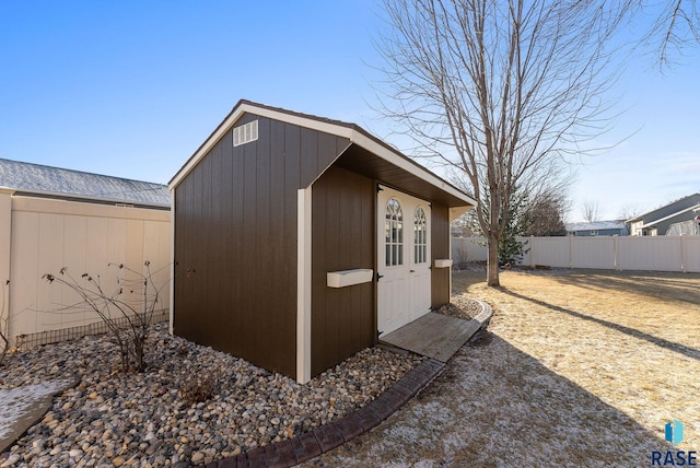 view of shed featuring a fenced backyard