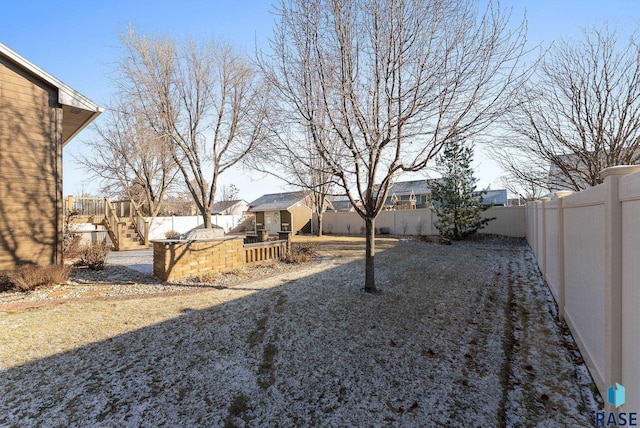 view of yard with a fenced backyard