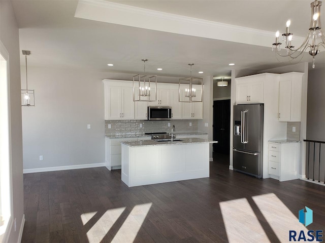 kitchen featuring backsplash, appliances with stainless steel finishes, dark wood-type flooring, white cabinets, and a sink