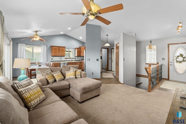 living room with lofted ceiling, ceiling fan, light carpet, and recessed lighting