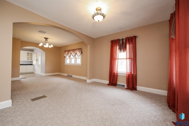 unfurnished room with carpet floors and visible vents