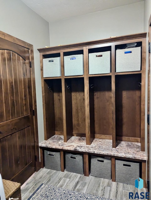 mudroom with wood finished floors