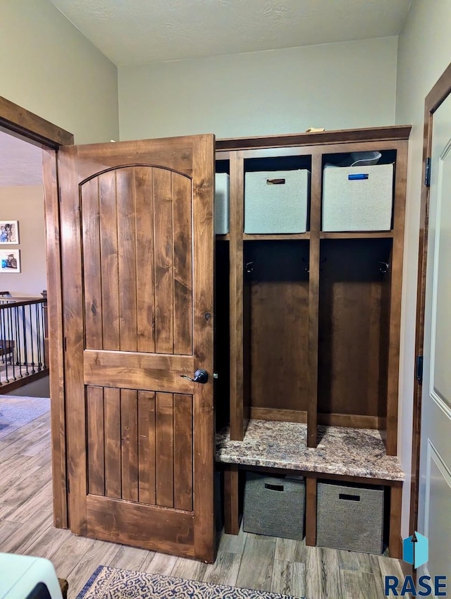 mudroom with wood finished floors