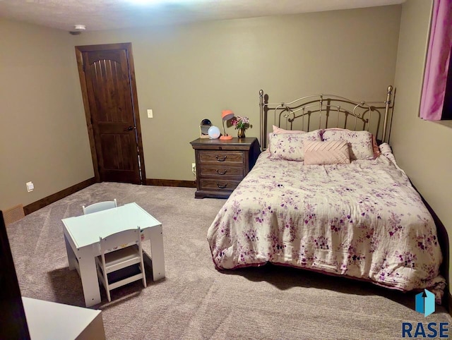 carpeted bedroom with visible vents and baseboards