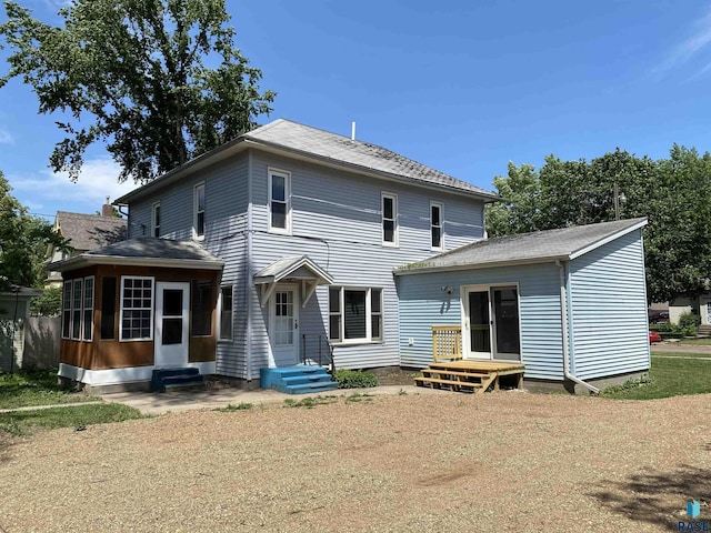 back of house featuring entry steps