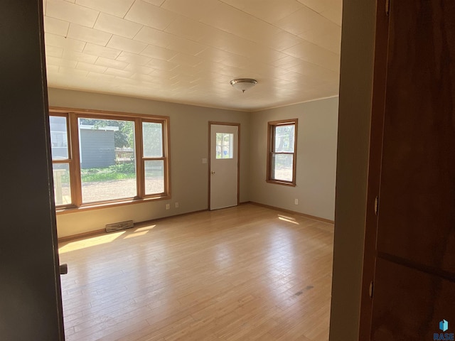 interior space with light wood-style flooring and baseboards