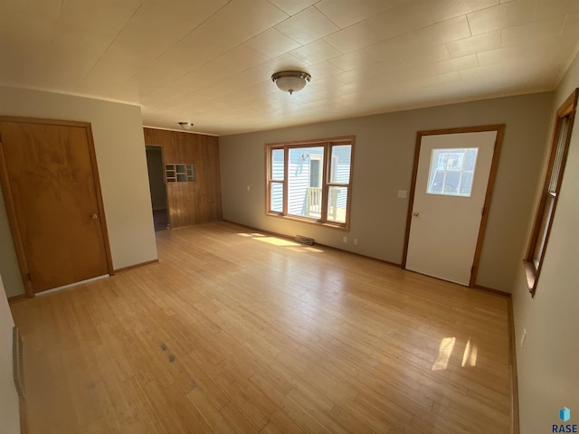 unfurnished living room with light wood-type flooring